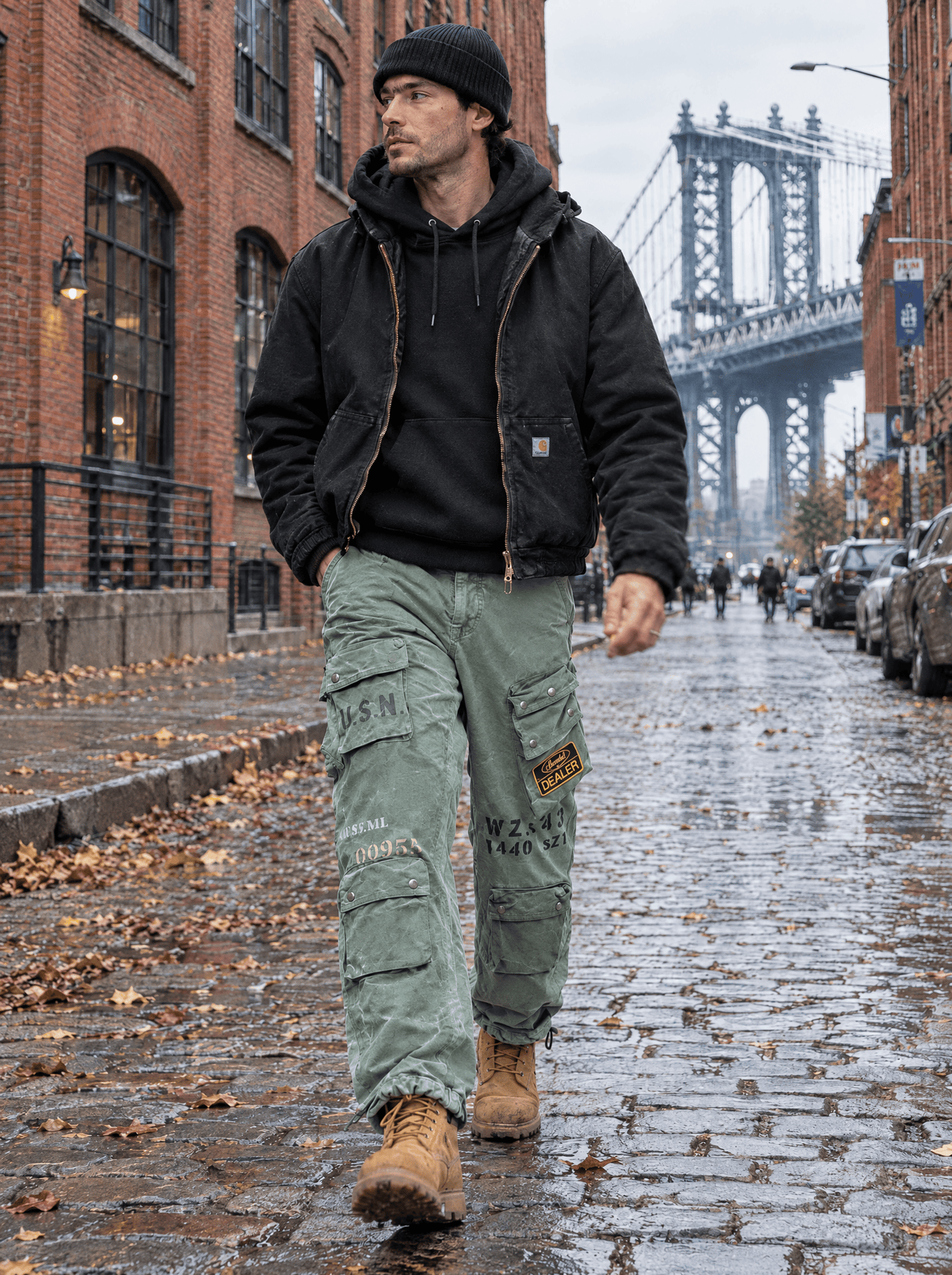 Man walking on a DUMBO Brooklyn cobblestone street wearing Xavier Pelham Bay Cargo Pants